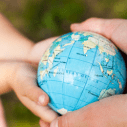 hands holding globe